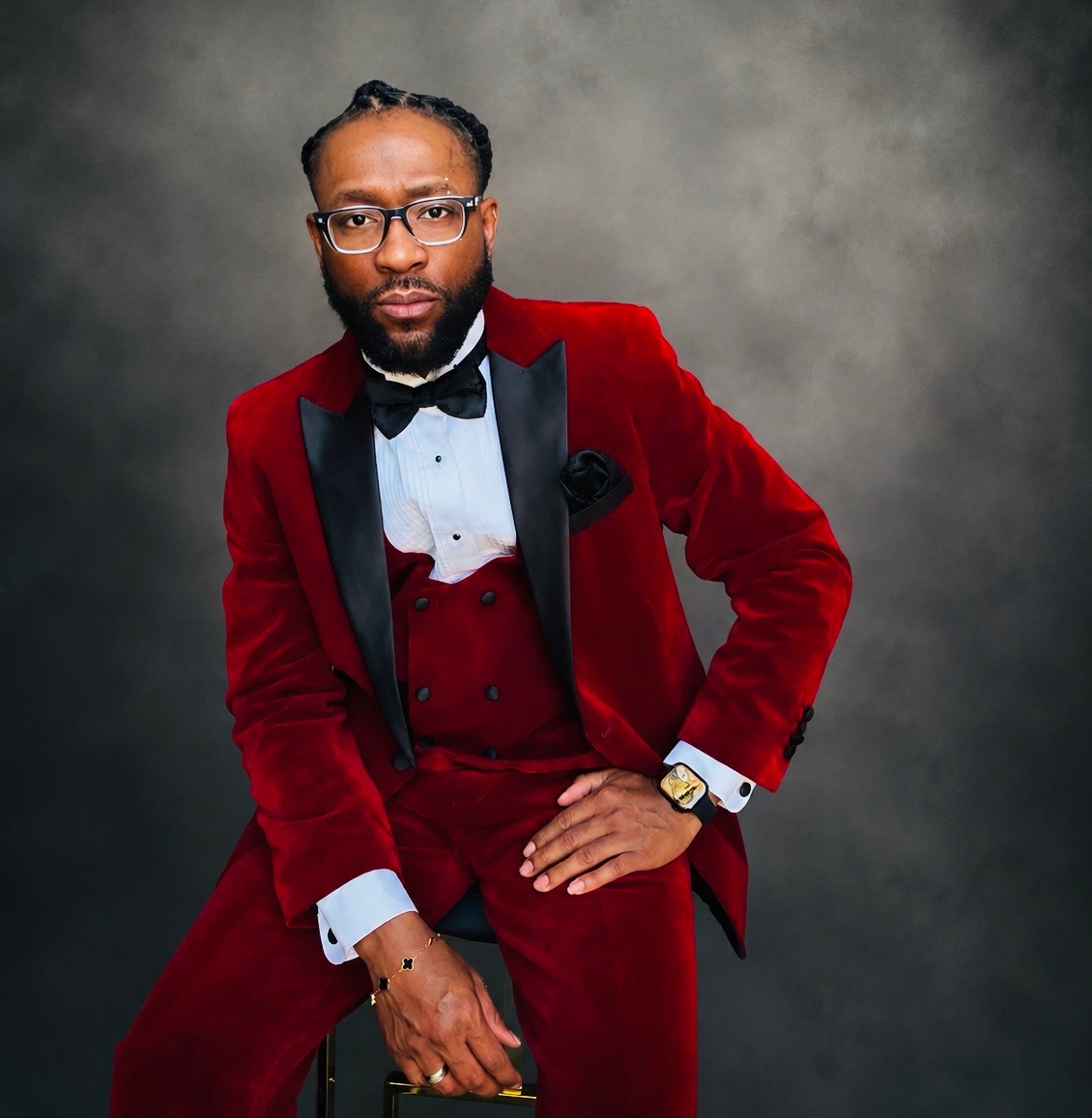 Pastor Kole Coleman wearing a red formal suit